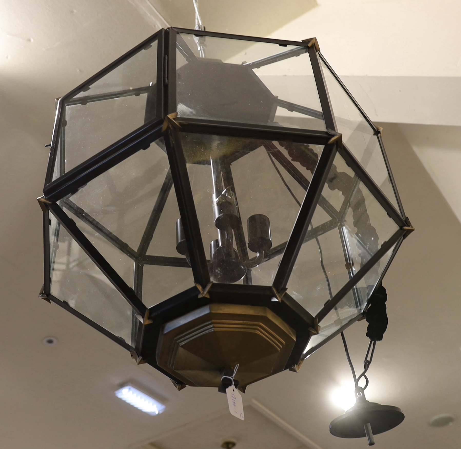 A pair of contemporary bronzed and black painted octagonal lanterns, 64cm wide, 90cm high